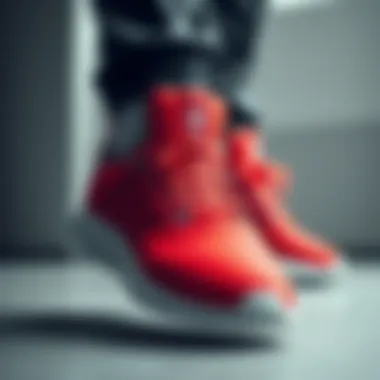 Sporty red Adidas footwear with sleek design