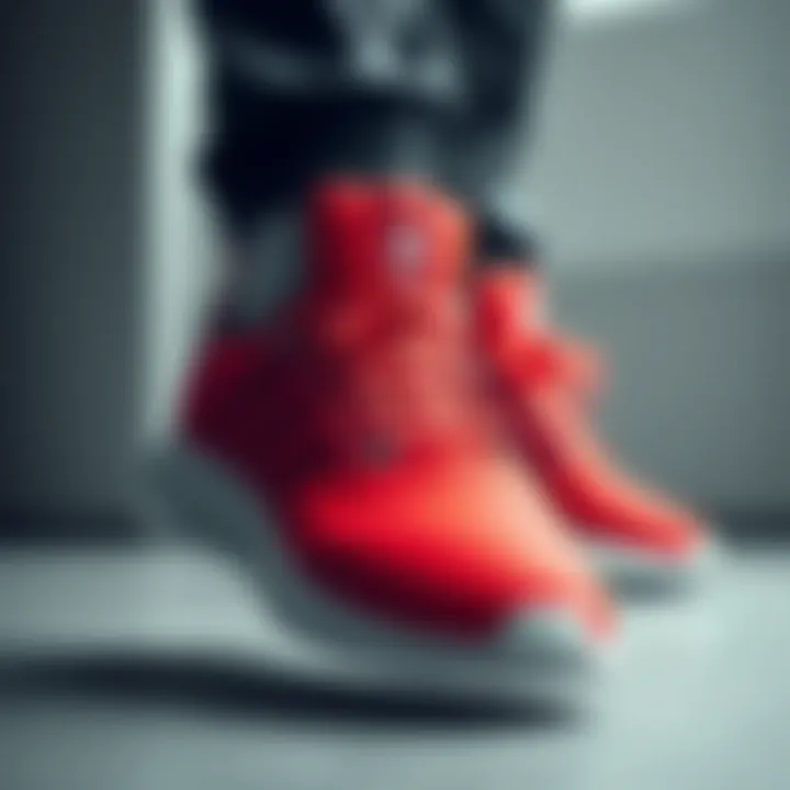 Sporty red Adidas footwear with sleek design