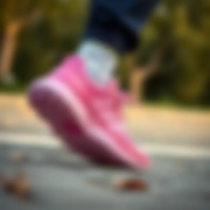 Adidas Tensaur pink being worn in an active lifestyle setting