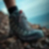 A rugged hiking shoe showcasing durability and traction on a rocky terrain.
