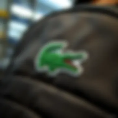 A close-up of the iconic Lacoste logo on a bag