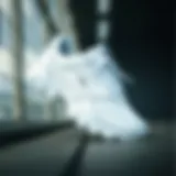 Stylish white Lotto sports shoe design