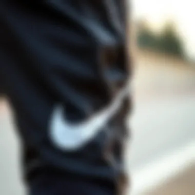 Close-up of Nike parachute pants highlighting fabric and design details.