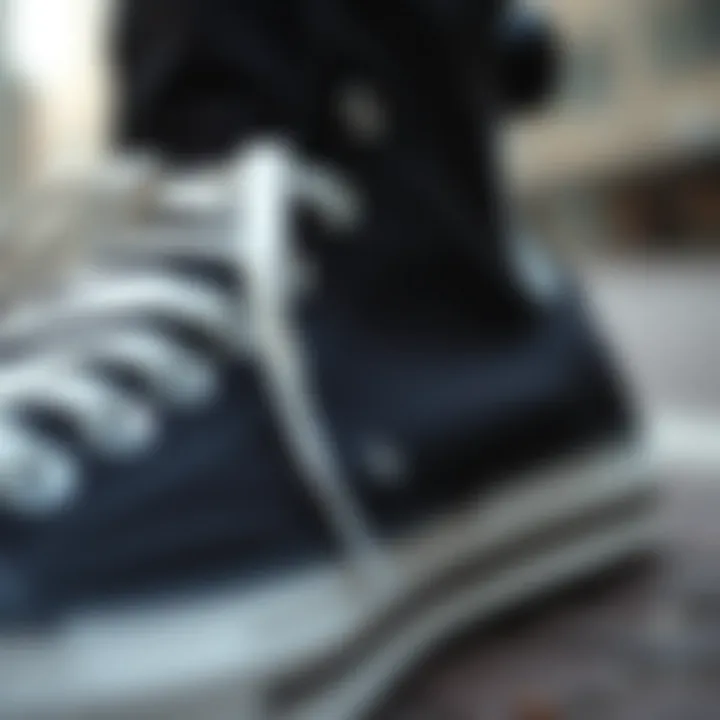 Close-up of black Converse highlighting craftsmanship.