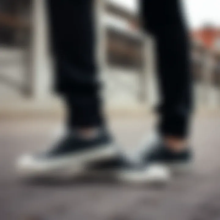 Stylish outfit featuring black Converse shoes.